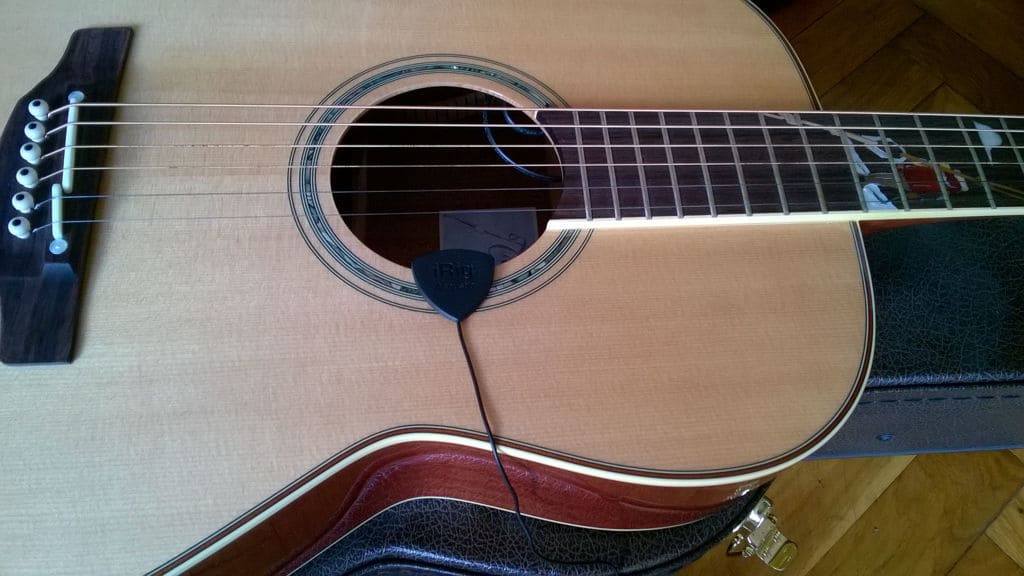 Mounting the iRig Acoustic Stage to an acoustic guitar is an easy task.
